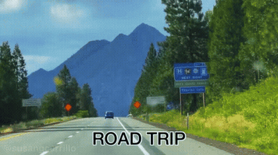 A Car Is Driving Down A Road With The Words Road Trip Below It GIF