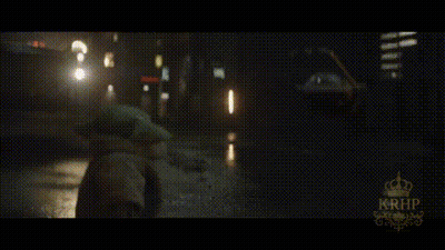 A Car Is Driving Down A Wet Street At Night With A Krhb Logo In The Corner GIF