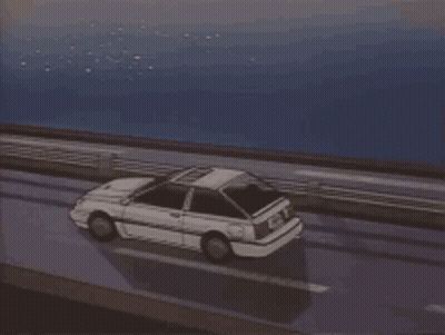 A Car Is Driving On A Highway Near The Ocean GIF