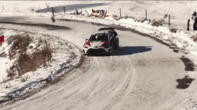 A Car Is Driving On A Snowy Road With The Word Toyota On The Side GIF