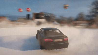 A Car Is Driving Through A Snowy Field With Balloons Flying In The Background GIF