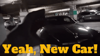 A Car Is Parked In A Parking Garage With The Words " Yeah New Car " Above It GIF