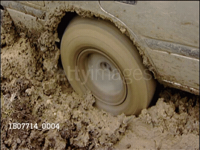 A Car Is Stuck In The Mud And Has The Number 1B07714_0004 On The Bottom Right GIF