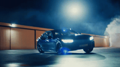 A Car That Has A License Plate That Says ' Aa ' On It Is Driving Down A Road GIF