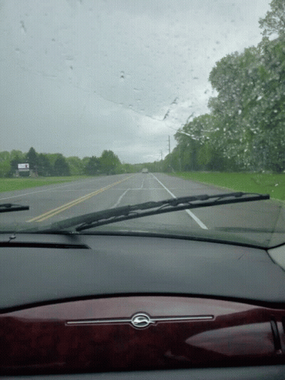 A Car Windshield With A Sign That Says ' I 'M Sorry I 'M Late ' On It GIF