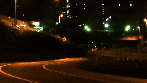 A Car With A License Plate That Says ' A ' On It Is Driving Down A Dark Street GIF