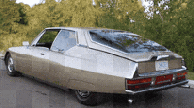 A Car With A License Plate That Says ' Nc ' On It Is Parked On The Side Of The Road GIF