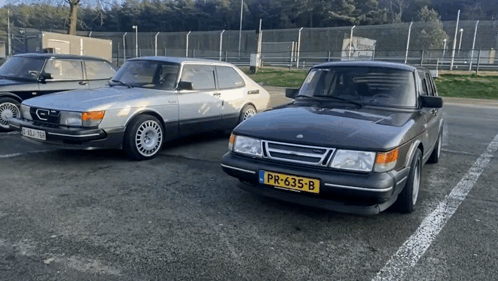 A Car With A License Plate That Says Pr-633-B Is Parked Next To Another Car GIF