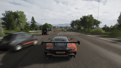 A Car With A License Plate That Says ' Rc Tf ' On It Is Driving Down A Road GIF
