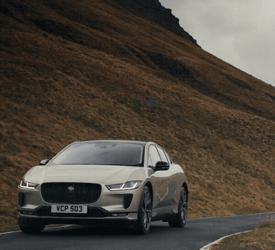 A Car With A License Plate That Says Vcp 503 Drives Down A Road GIF
