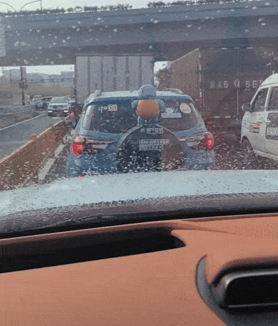 A Car With A Sticker On The Back That Says Suzuki GIF