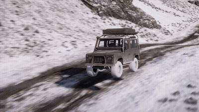 A Car With A Tent On Top Of It Is Driving On A Snowy Road GIF