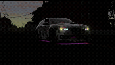 A Car With Purple And Green Lights On The Front GIF
