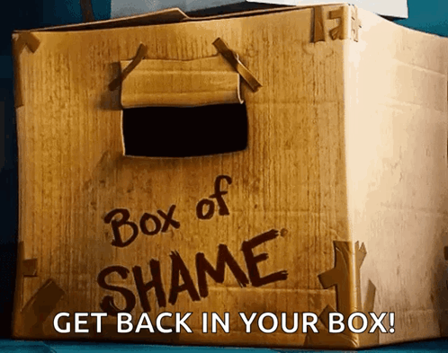A Cardboard Box That Says " Box Of Shame " On It GIF