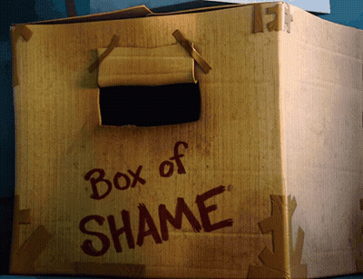A Cardboard Box That Says Box Of Shame On The Side GIF