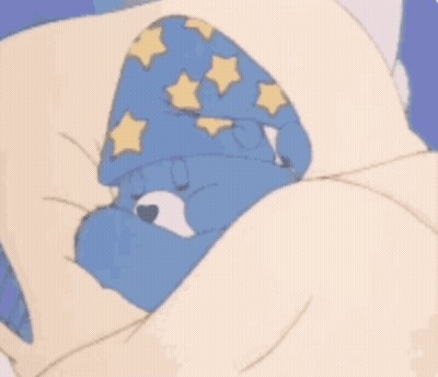 A Care Bear Is Sleeping In A Bed With The Words Sweet Dreams Above Him GIF