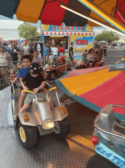 A Carnival Ride Has A Sign That Says Tickets On It GIF
