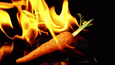 A Carrot That Is On Fire With The Word Shutterstock In The Background GIF