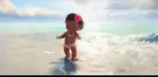 A Cartoon Baby Girl With A Flower In Her Hair Is Standing On A Beach . GIF