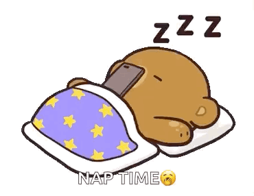 A Cartoon Bear Is Sleeping In A Bed With A Cell Phone In His Hand . GIF