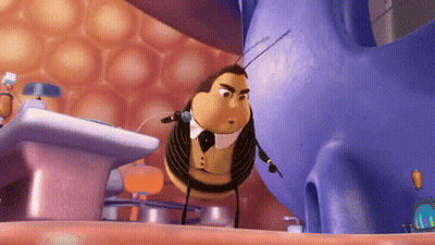 A Cartoon Bee Wearing A Tuxedo And Bow Tie Is Standing Next To A Purple Object GIF