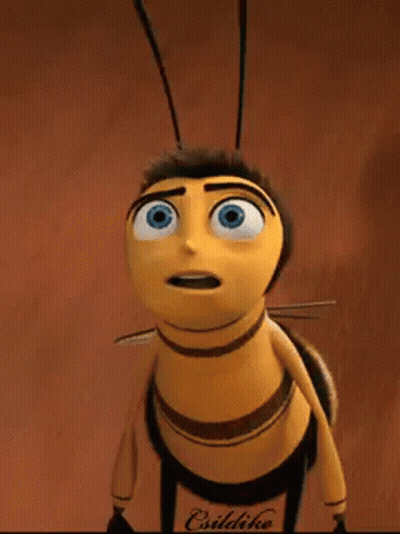 A Cartoon Bee With Blue Eyes Is Standing On A Brown Surface And Looking Up . GIF