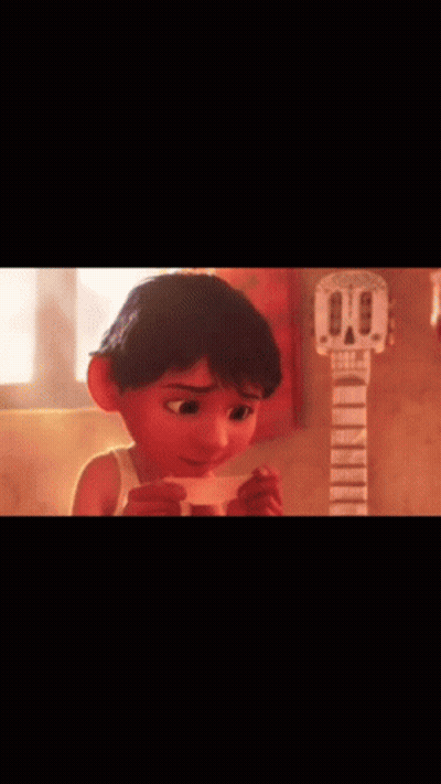 A Cartoon Boy Is Holding A Piece Of Paper In Front Of A Guitar . GIF