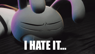 A Cartoon Bunny Is Laying On The Floor With The Words " I Hate It " Below It GIF