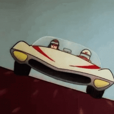 A Cartoon Car Is Driving Down A Hill With Two People In It . GIF