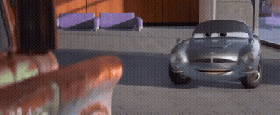A Cartoon Car Is Sitting In A Room Next To A Couch And A Chair . GIF