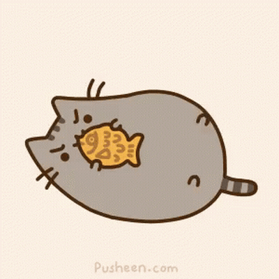 A Cartoon Cat Is Eating A Fish Shaped Cookie GIF