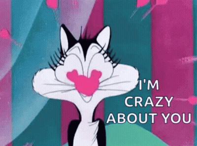 A Cartoon Cat Is Holding A Heart In Its Mouth And Says `` I 'M Crazy About You '' . GIF