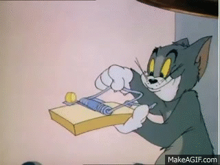 A Cartoon Cat Is Holding A Mousetrap In His Hands And Smiling . GIF