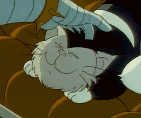 A Cartoon Cat Is Laying Down And Smiling GIF
