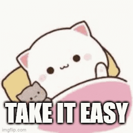 A Cartoon Cat Is Laying In A Bed With A Stuffed Animal And The Words `` Take It Easy '' . GIF