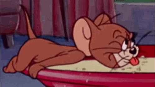 A Cartoon Cat Is Laying In A Bowl Of Soup . GIF