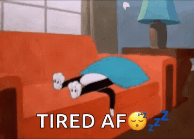 A Cartoon Cat Is Laying On A Couch With The Words Tired Af Written Above It . GIF