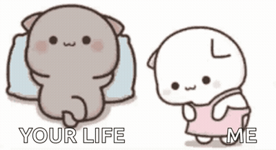 A Cartoon Cat Is Laying On A Pillow And A Cartoon Cat Is Standing Next To It . GIF