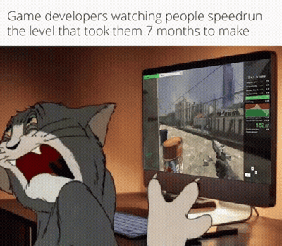 A Cartoon Cat Is Playing A Video Game On A Computer Monitor GIF
