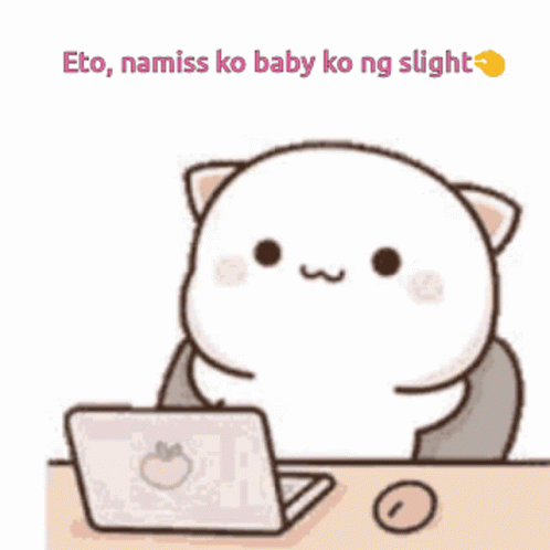 A Cartoon Cat Is Sitting At A Desk With A Laptop Computer . GIF