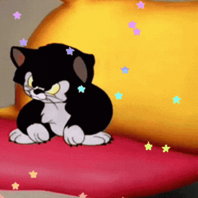 A Cartoon Cat Is Sitting On A Red Pillow GIF