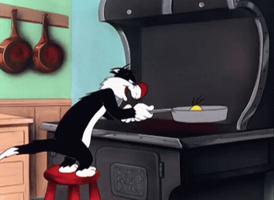 A Cartoon Cat Is Sitting On A Red Stool Cooking GIF