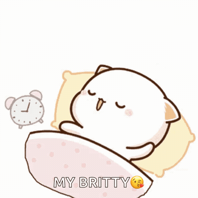 A Cartoon Cat Is Sleeping In A Bed With An Alarm Clock Behind It GIF