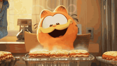 A Cartoon Cat Named Garfield Is Sitting At A Table Eating Lasagna GIF