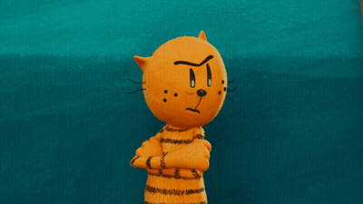 A Cartoon Cat With A Face That Says T On It GIF