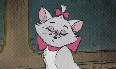 A Cartoon Cat With A Pink Bow On Its Head GIF