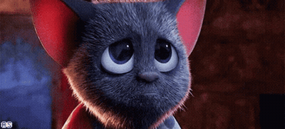 A Cartoon Cat With A Sad Look On Its Face Is Wearing A Red Hat . GIF