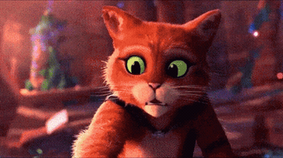A Cartoon Cat With Green Eyes Looking At The Camera GIF