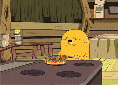 A Cartoon Character Cooking On A Stove With A Frying Pan On Fire GIF