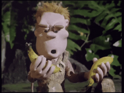 A Cartoon Character Eating A Banana With A Surprised Expression On His Face GIF